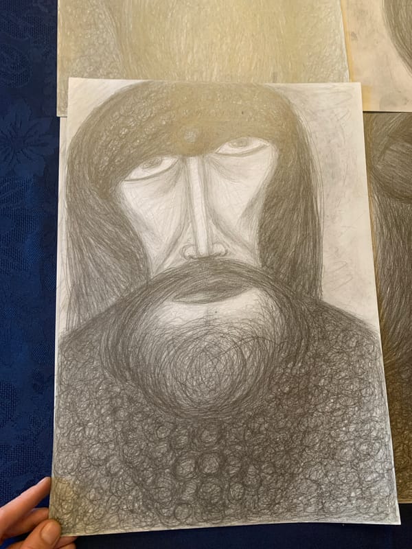 Indoor art collection featuring portrait sketches and Klimt prints