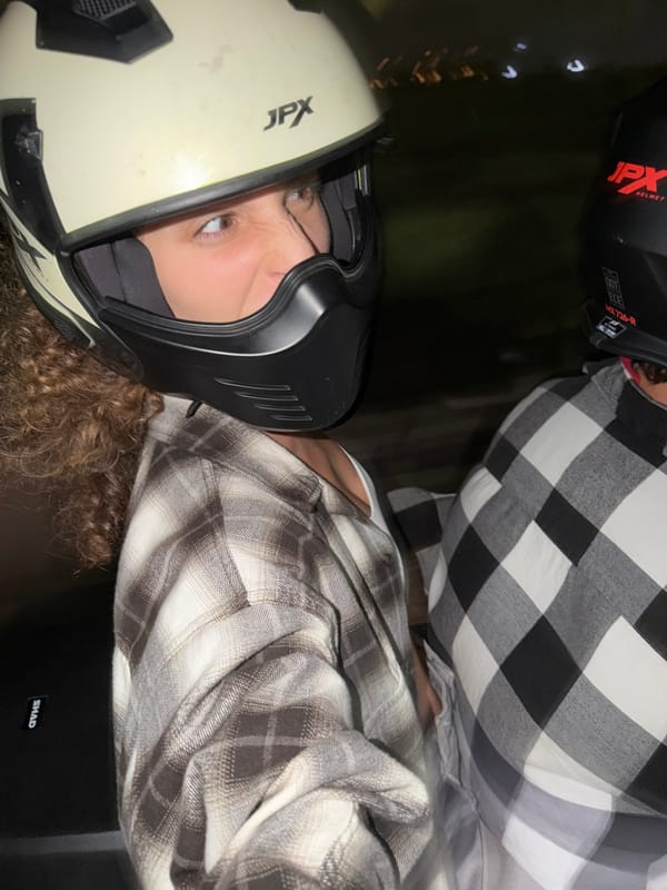 Nighttime motorcycle riders photographed in North Kuta, Indonesia
