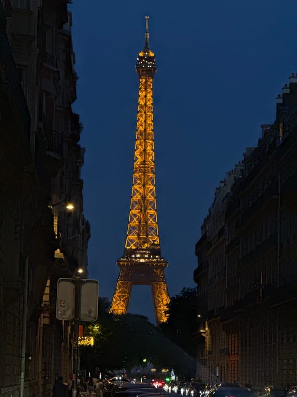 Eiffel Tower glowing at dusk, Paris streets at golden hour