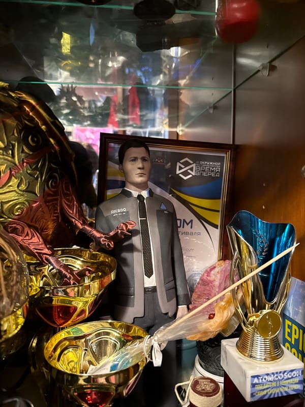 Moscow resident documents cluttered home filled with gaming collectibles, pets