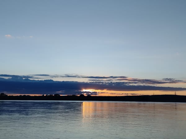 Sunset captured over water near Chaikovsky, Russia
