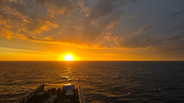 Sunset observed from vessel over ocean waters