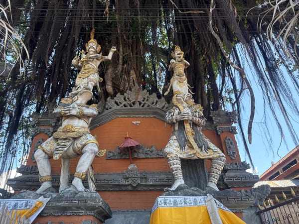 Balinese temple architecture and ceremonial decorations observed in Kubu