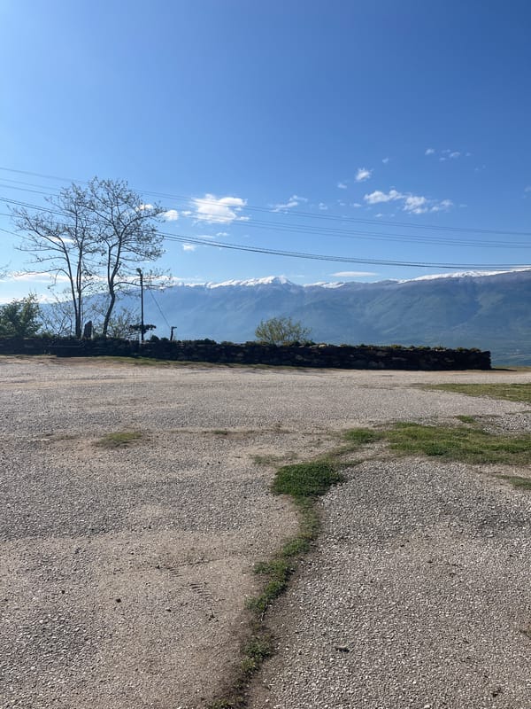 Roadside landscape with stone wall documented in Parvomai, Bulgaria