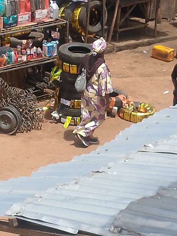 Daily marketplace activity documented in Bukuru, Nigeria automotive district