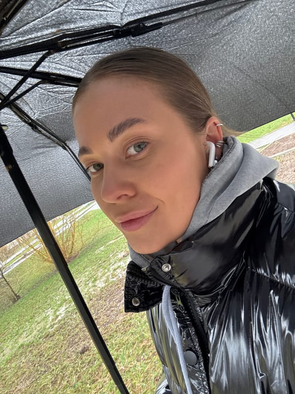 Woman takes umbrella selfies during outdoor walk in Chernushka