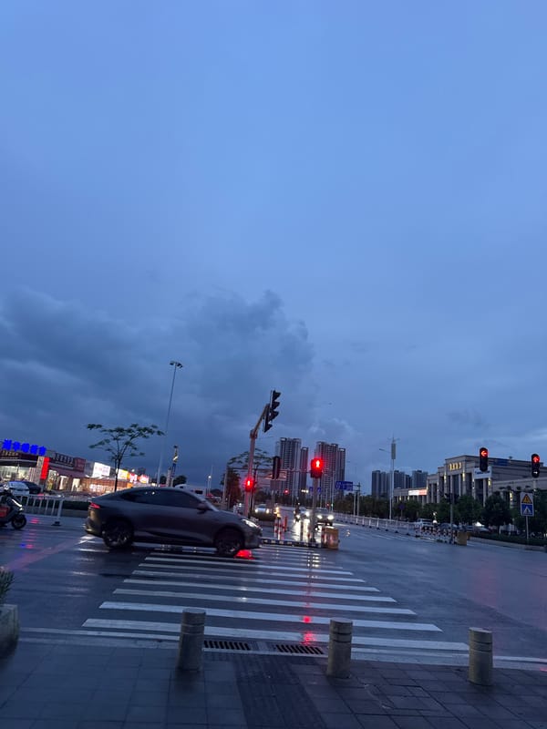 Stormy dusk streets in Huizhou, pink bunny keychain in hand