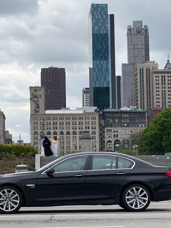 Vehicles parked on Chicago street amid urban landscape