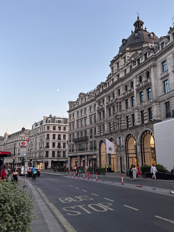 London street architecture and a gibbous moon, same evening