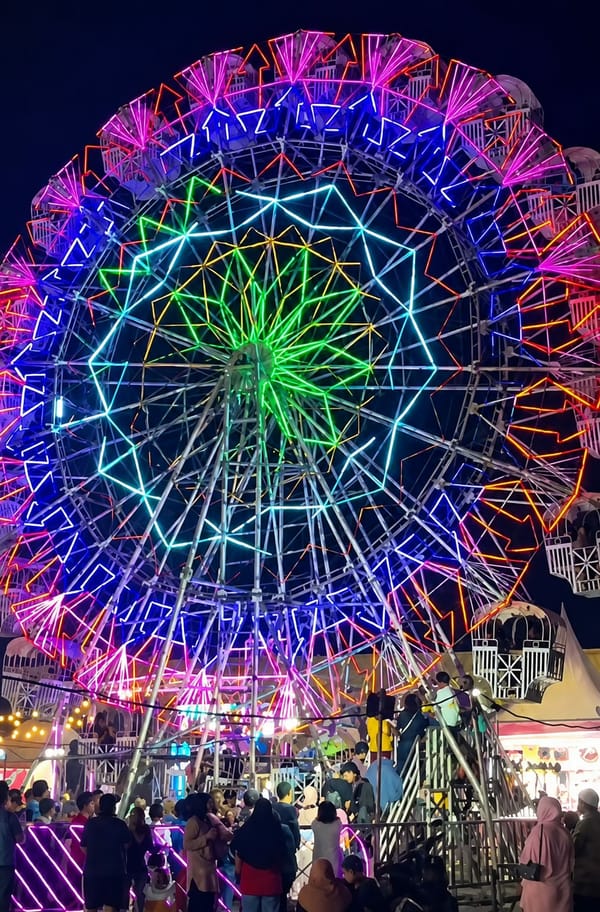 Neon-lit fairground night in Medan, Indonesia