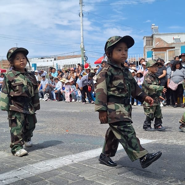 Children in camouflage uniforms march in Paucarpata parade