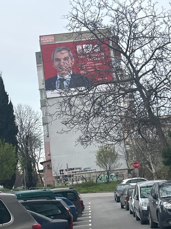 Political billboard spotted on Varna building displays suited figure