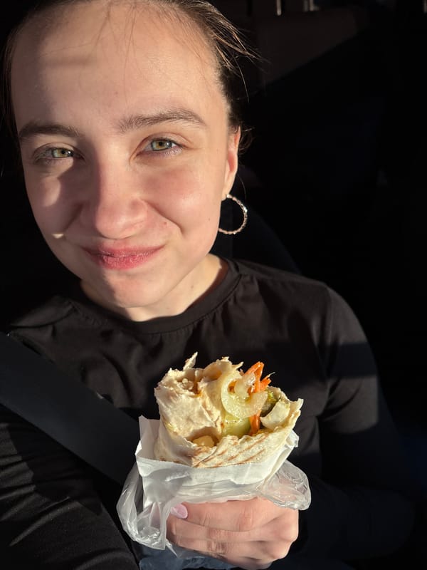 Young woman photographed in car with food in Votkinsk