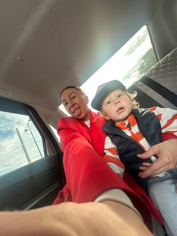 Woman holds child in vehicle in Votkinsk, Russia