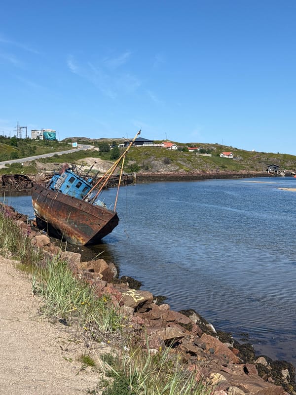 Abandoned shipwrecks line the rocky shore of Teriberka, Russia