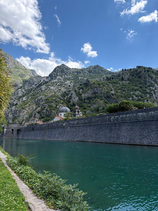 Tourist documents morning scenes in historic Kotor, Montenegro