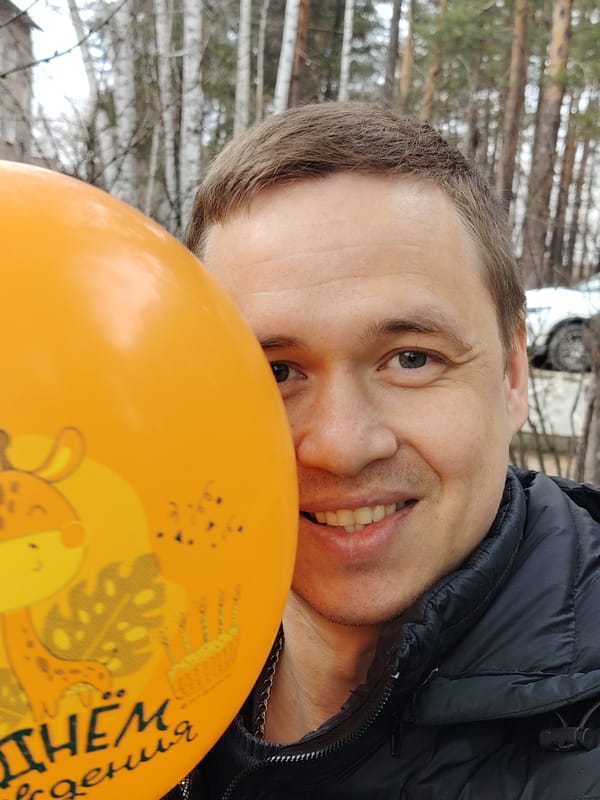 Couple enjoys playful photo session in Chaikovsky forest