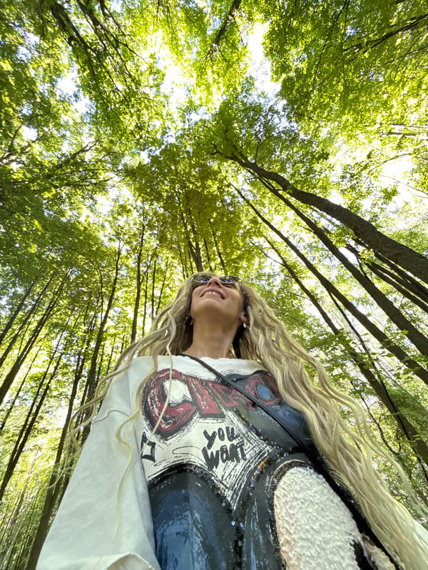 Woman takes forest selfies in Rusanovo, Russia