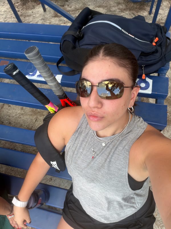 Tennis player rests on park bench in Puebla