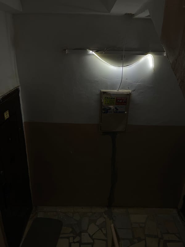 Interior corner with LED lighting and stickered utility box