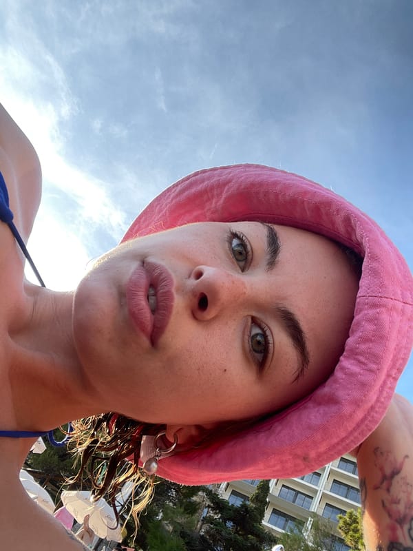 Woman enjoys beach day in Rafailovići, Montenegro