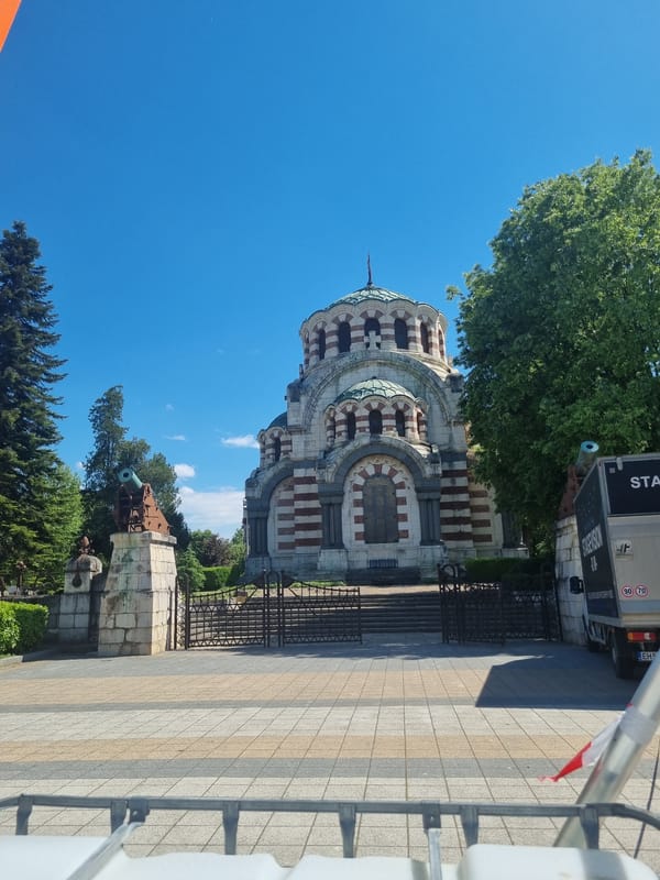Tourist captures Pleven landmarks during midday visit in Bulgaria