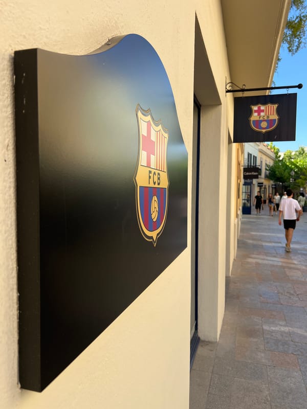 FC Barcelona branded retail signage on a sunny day in Vallès