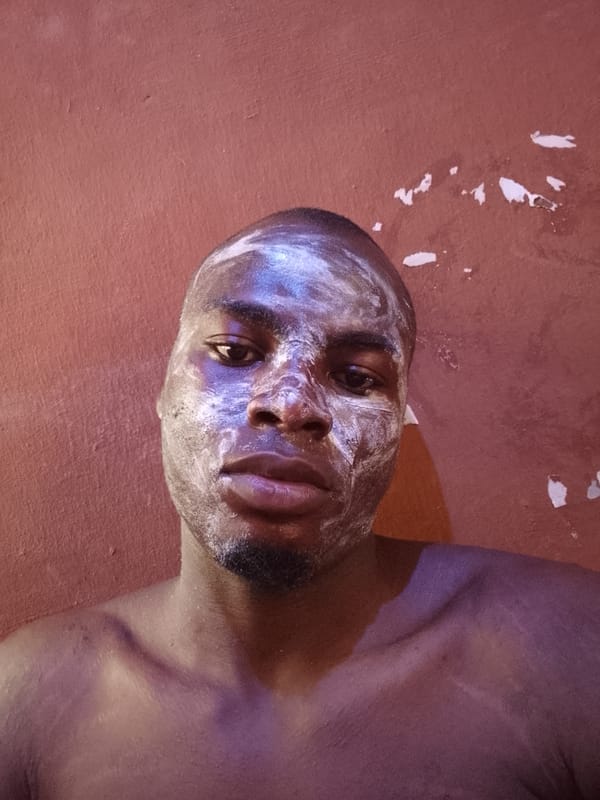 Man with white face cream photographed in Ilorin, Nigeria