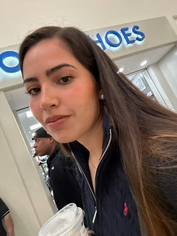 Woman named Valeria enjoys coffee during San Antonio mall visit