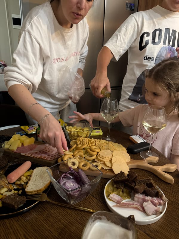 Family gathering with food and drinks documented in Razvilka
