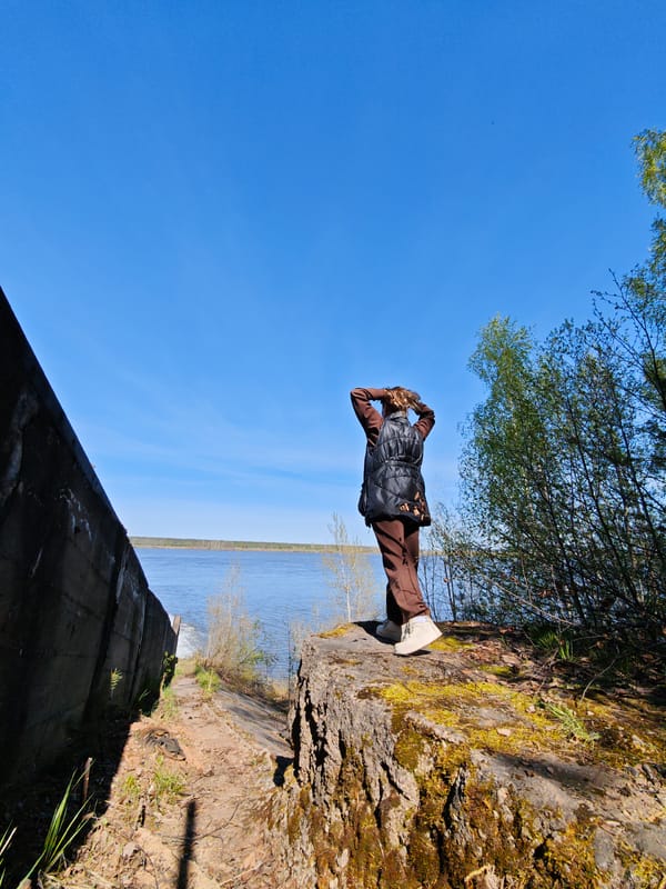 Woman documents dam spillway visit in Chernushka, Russia