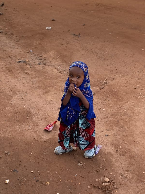Daily street life documented in Abuja market district