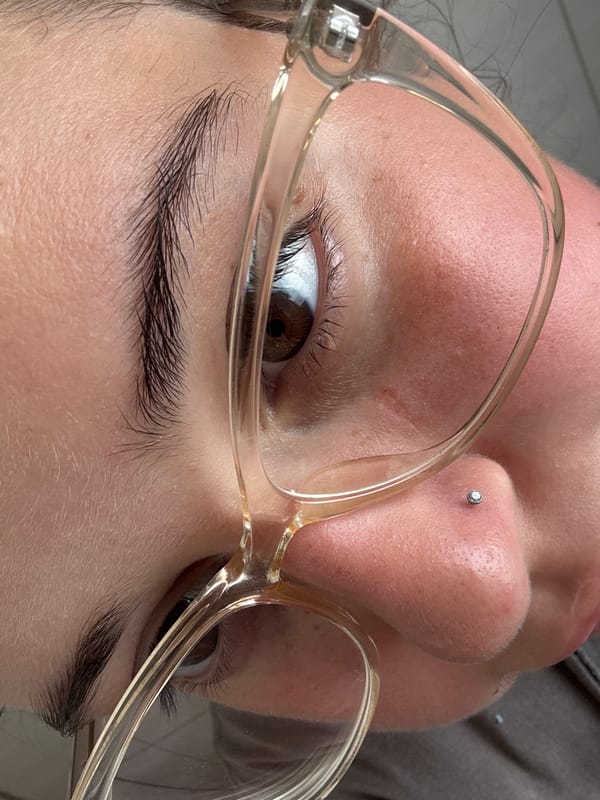 Close-up portrait detail: glasses and nose stud in Bad Säckingen