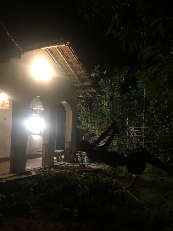 Evening scenes around a lit structure in Kabalana, Sri Lanka