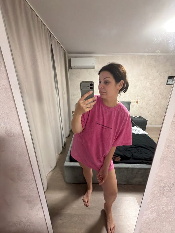 Woman documents evening selfie session in Sochi bedroom