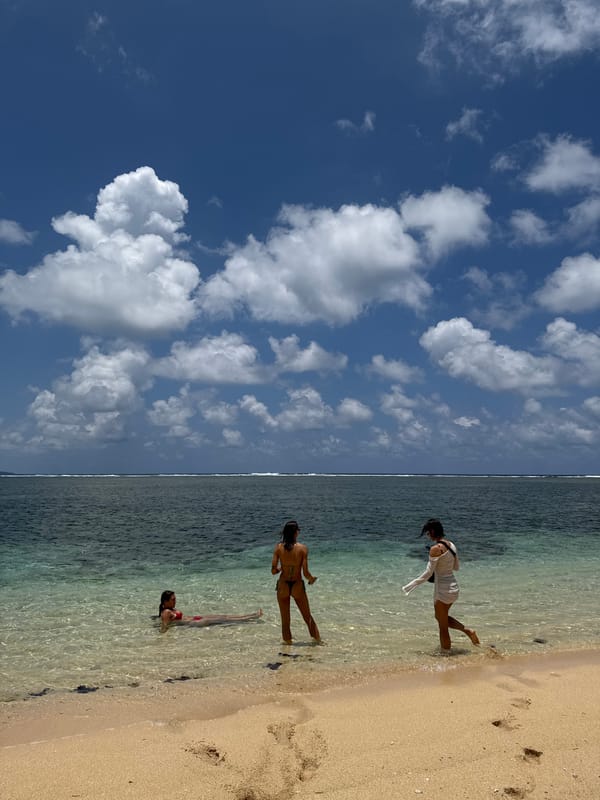 Two women enjoy early morning beach time in General Luna