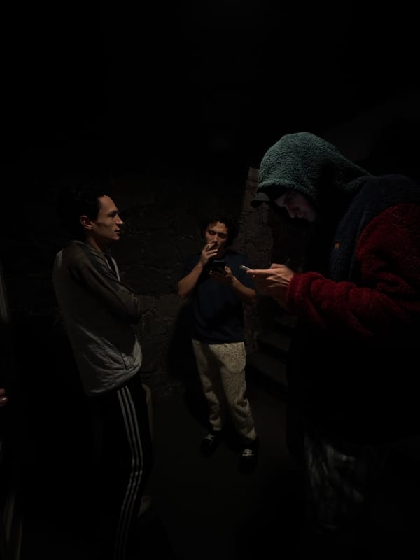 Three people rest on couch during early morning in Mexico City
