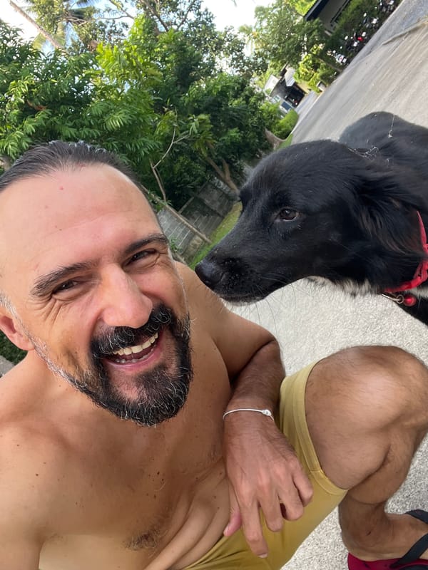 Selfies with a black dog at golden hour in Ko Samui