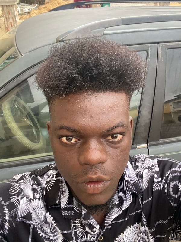 Young man photographed with personal belongings in residential area