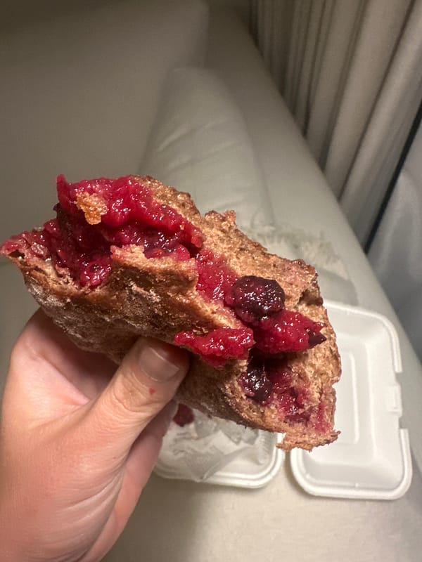 Person enjoys bread with spreads in Abu Dhabi