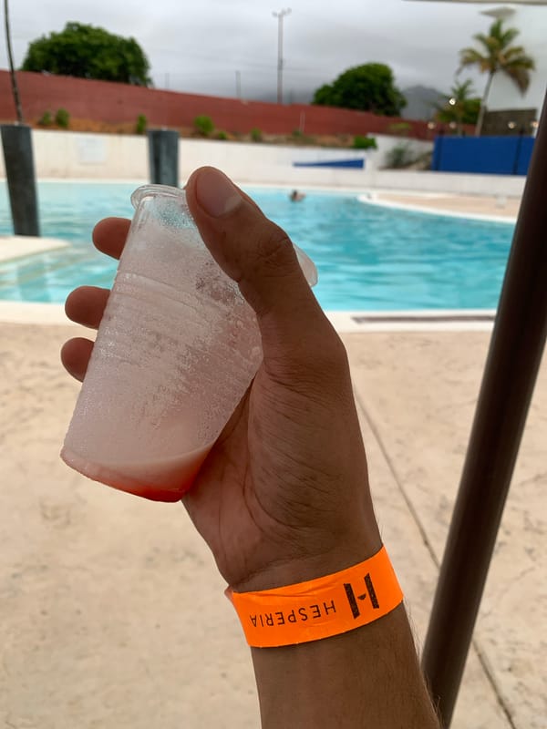 Tourist documents poolside afternoon at Venezuelan beach resort