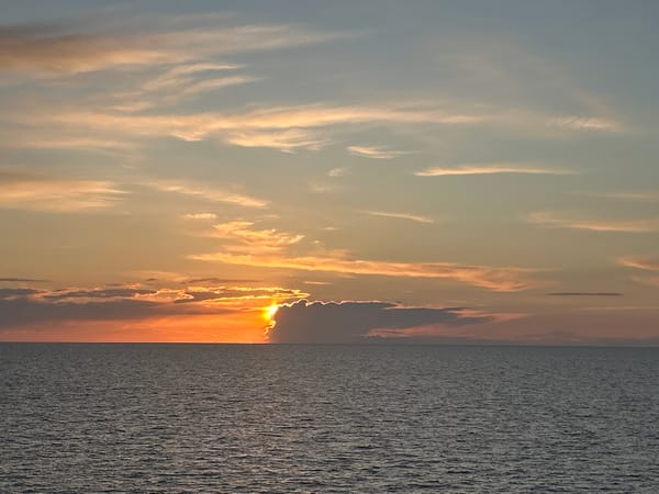 Sunset maritime operations documented near Baltic construction vessel TITANS
