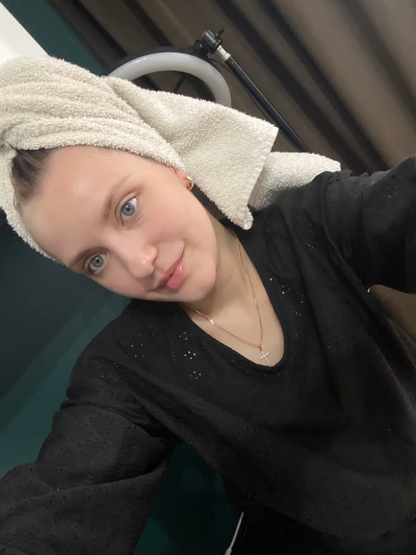 Woman takes indoor selfies in Марковский, Russia