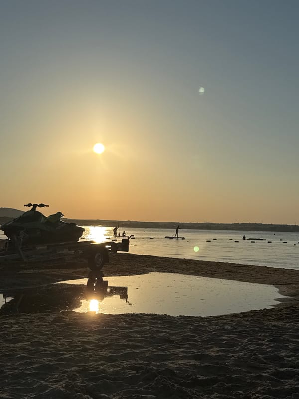 Warm sunset light over a sandy beach in Sozopol, Bulgaria.