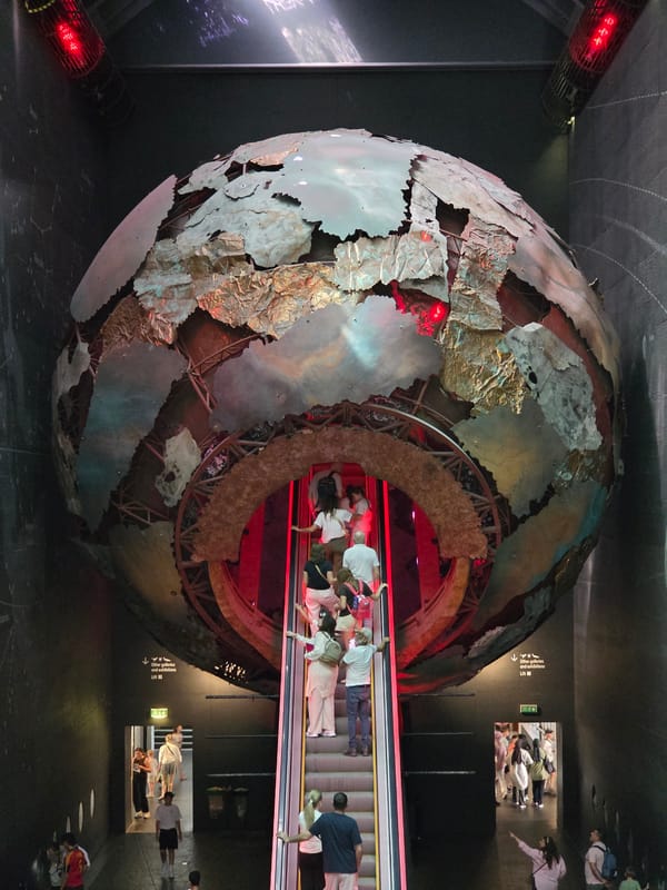 Globe sculpture with escalator draws crowds at London Natural History Museum