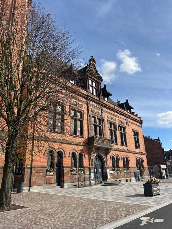 Woman and cat share quiet afternoon moment in Estaires home
