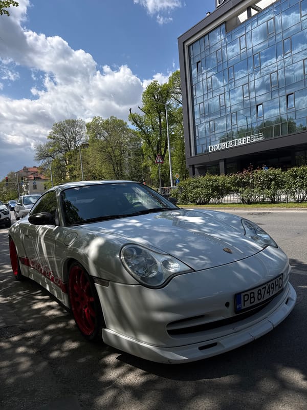 Man poses with white Porsche for selfies in Plovdiv