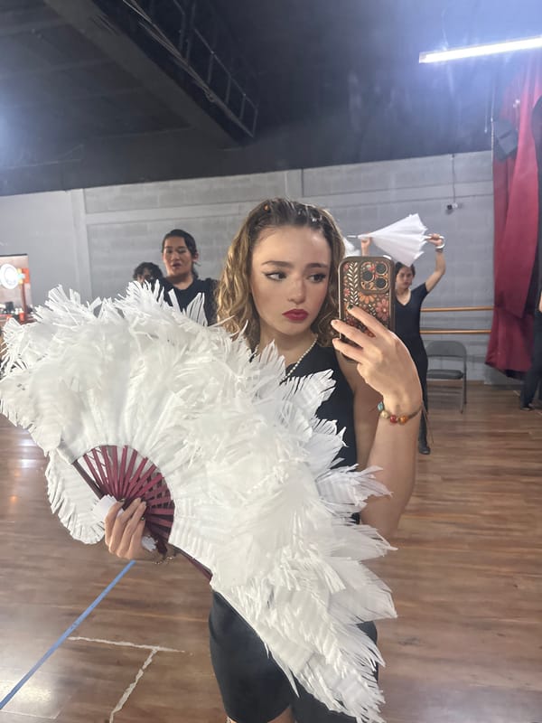 Dance rehearsal with white feather fans in a Puebla studio