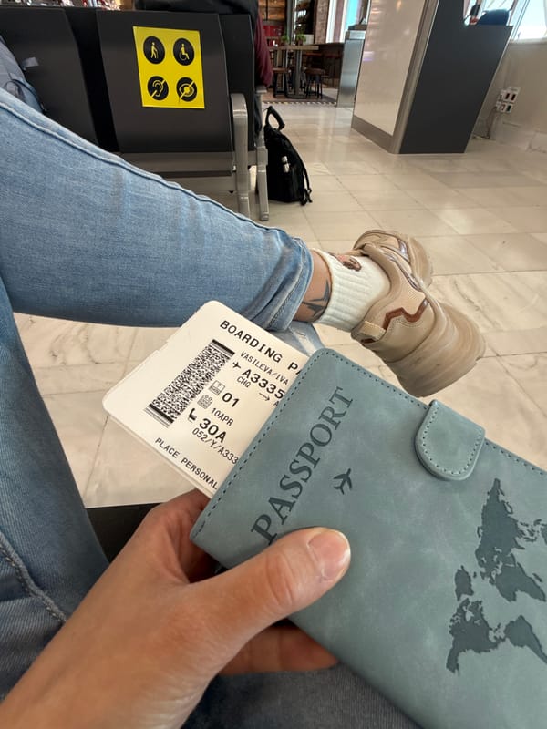Traveler holds boarding pass at Chania Airport, Greece