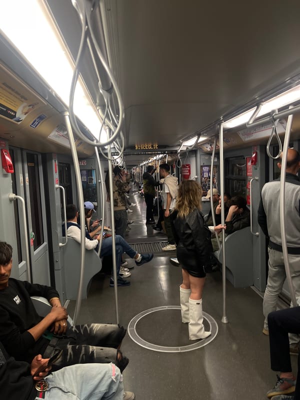 Evening commuters ride Milan subway at Bisceglie station